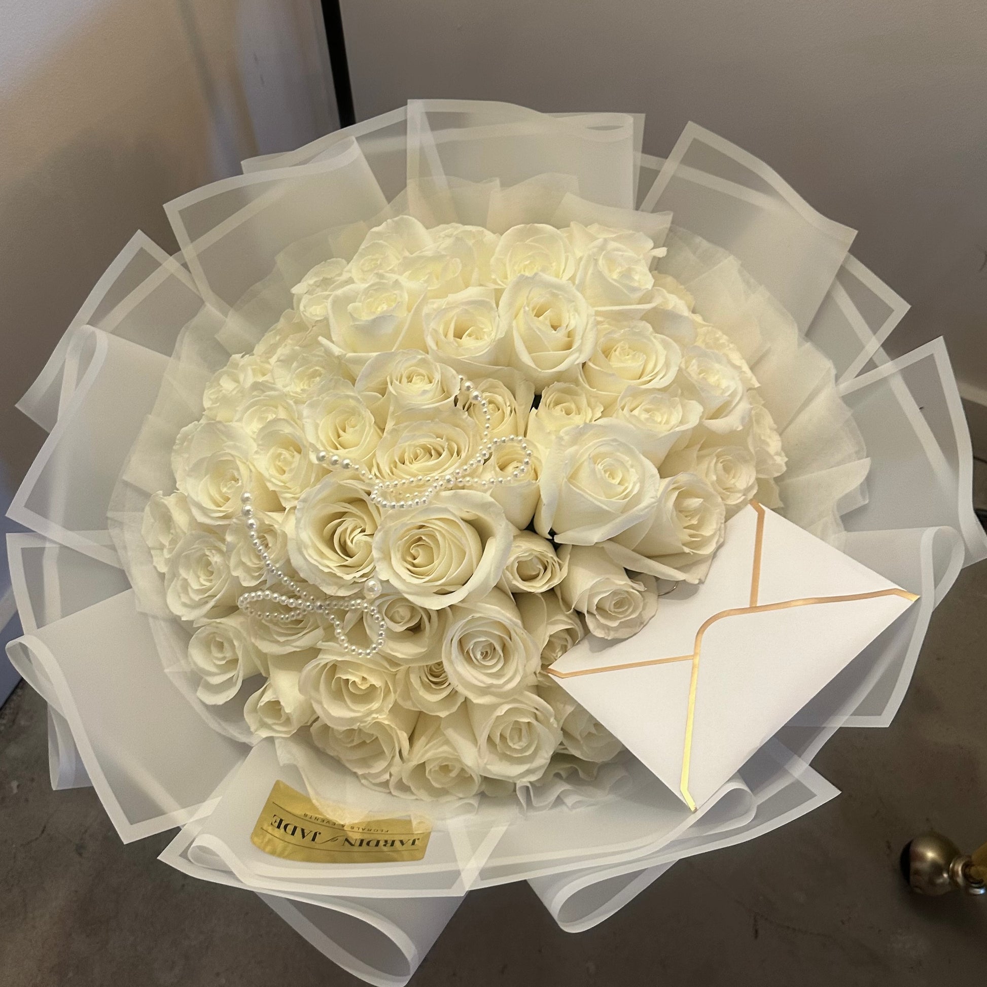 50 White Roses Wrapped Bouquet